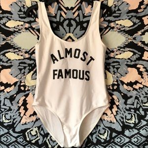 Almost Famous one piece white bathing suit(size M)